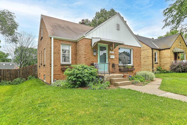 2954 S 48th St, Milwaukee, WI 53219 - view of front of house with brick siding, board and batten siding, and a shingled roof