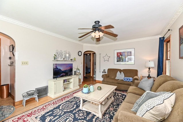2954 S 48th St, Milwaukee, WI 53219 - living area featuring arched walkways, ceiling fan, wood finished floors, and ornamental molding