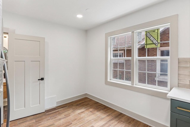 1617 69th St, Kenosha, WI 53143 - unfurnished room with light wood-style flooring and recessed lighting