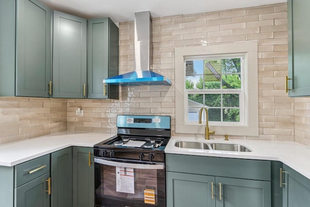 1617 69th St, Kenosha, WI 53143 - kitchen with wall chimney exhaust hood, gas range, green cabinets, backsplash, and light countertops