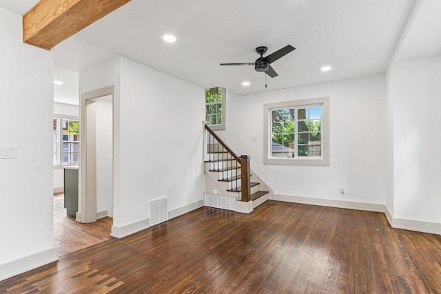 1617 69th St, Kenosha, WI 53143 - unfurnished living room featuring hardwood / wood-style flooring, plenty of natural light, ceiling fan, stairs, and recessed lighting