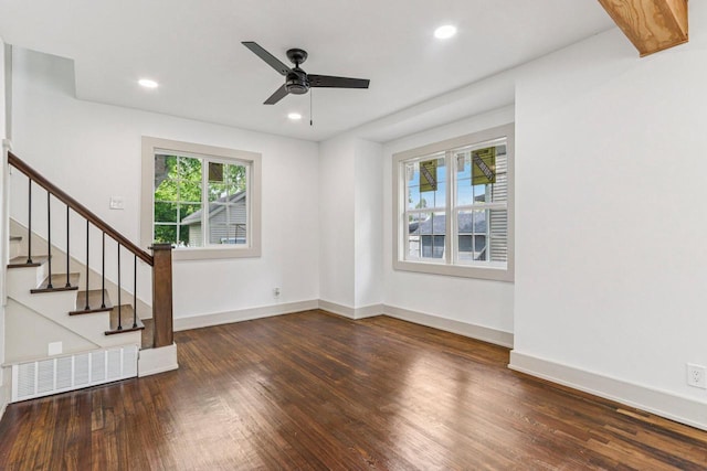 1617 69th St, Kenosha, WI 53143 - unfurnished living room with wood finished floors, ceiling fan, stairway, and recessed lighting