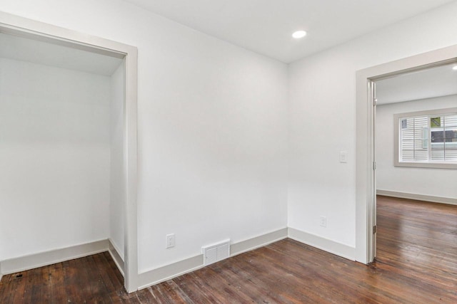 1617 69th St, Kenosha, WI 53143 - empty room with dark wood finished floors and recessed lighting