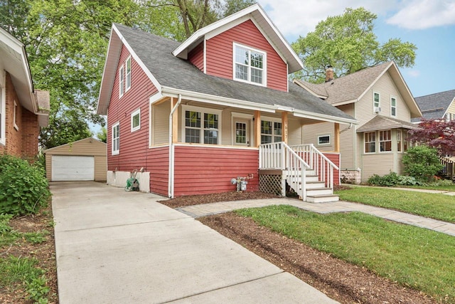 1617 69th St, Kenosha, WI 53143 - bungalow featuring an outdoor structure, a garage, a front yard, and roof with shingles