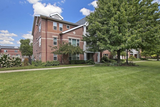 408 55th St Unit B, Kenosha, WI 53140 - view of front of property featuring brick siding and a front lawn