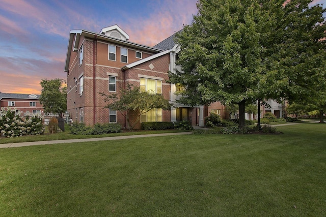 408 55th St Unit B, Kenosha, WI 53140 - view of front facade with brick siding and a lawn