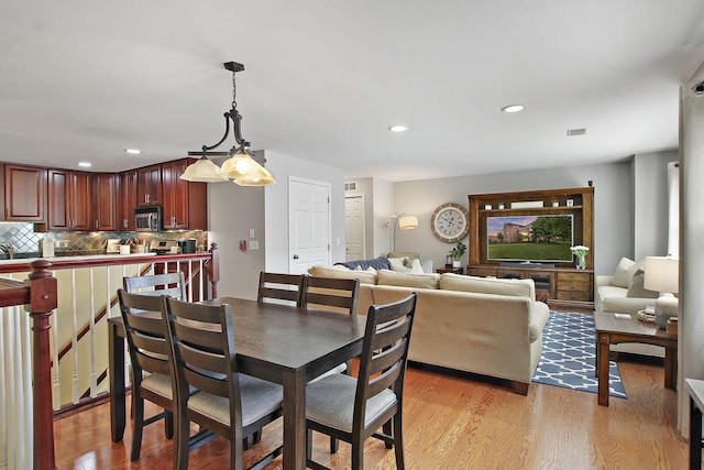 408 55th St Unit B, Kenosha, WI 53140 - dining room featuring light wood-type flooring and recessed lighting