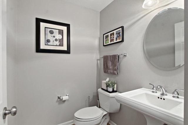 408 55th St Unit B, Kenosha, WI 53140 - half bathroom with a sink and toilet
