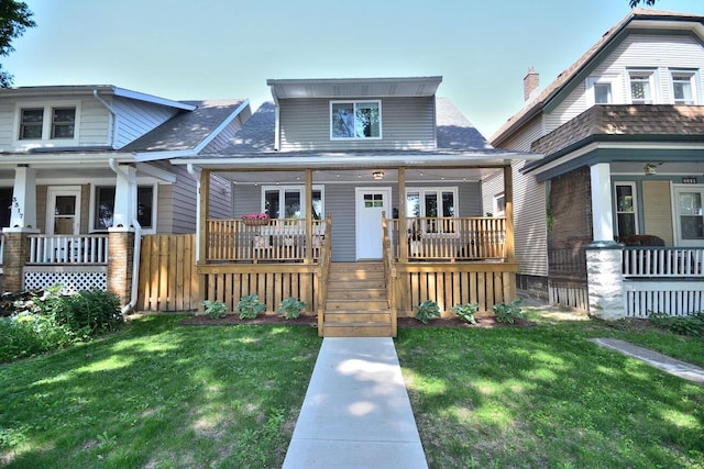3313 S Delaware Ave, Milwaukee, WI 53207 - bungalow with covered porch, a front yard, and a shingled roof