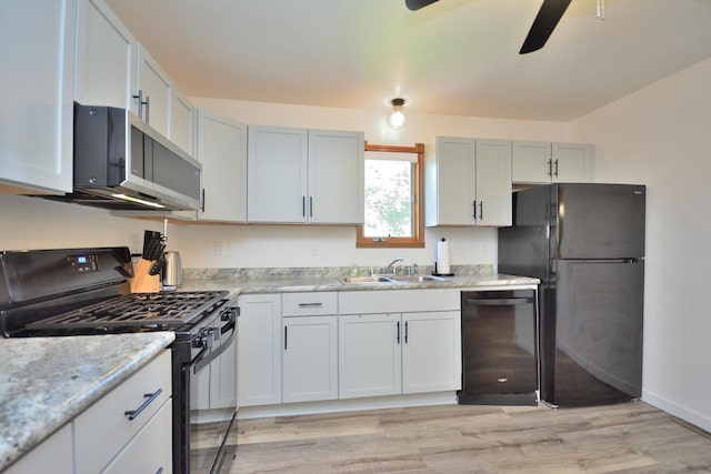 3313 S Delaware Ave, Milwaukee, WI 53207 - kitchen with black appliances, ceiling fan, light wood-style flooring, and light stone countertops