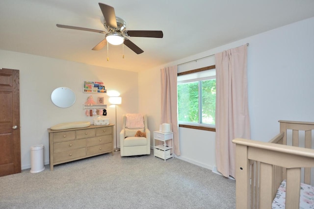 3313 S Delaware Ave, Milwaukee, WI 53207 - bedroom with a crib, ceiling fan, and carpet floors
