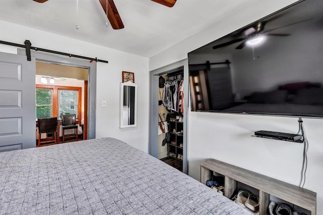 517 12th Ave, Green Bay, WI 54303 - bedroom featuring a barn door, a closet, and a ceiling fan