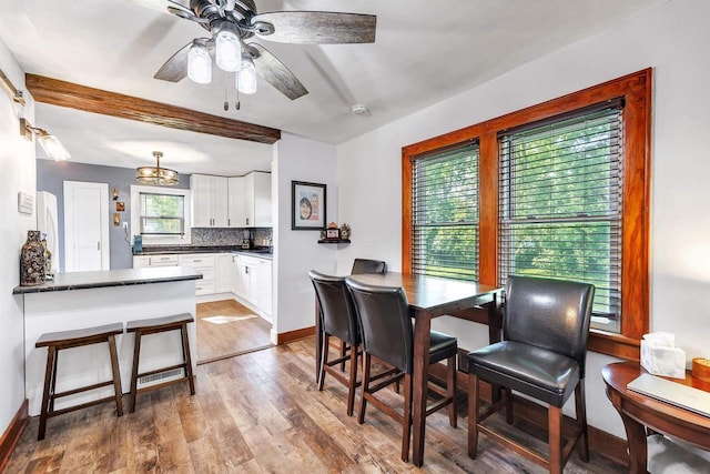 517 12th Ave, Green Bay, WI 54303 - dining space featuring light wood-style flooring, beam ceiling, and a ceiling fan