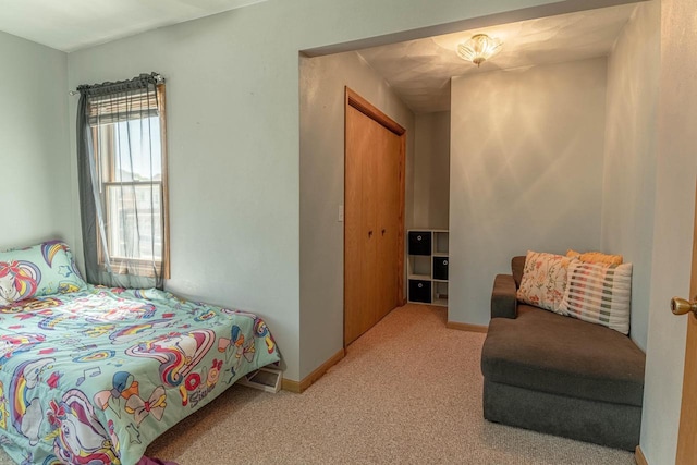 1915 7th St, Monroe, WI 53566 - bedroom featuring light colored carpet and a closet