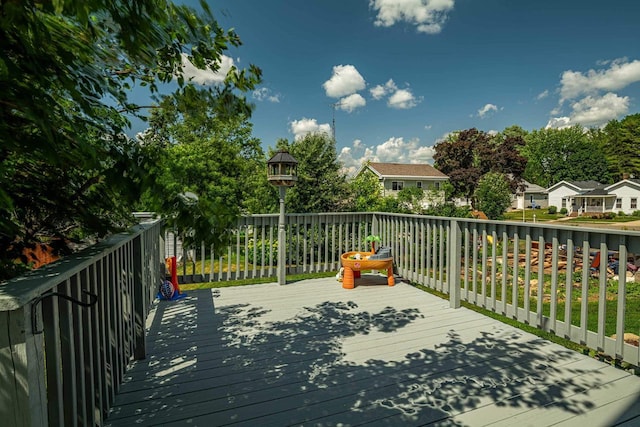1915 7th St, Monroe, WI 53566 - wooden terrace featuring a residential view