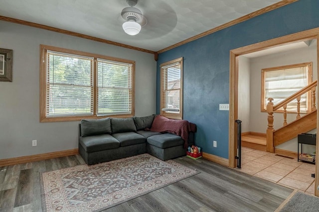 1915 7th St, Monroe, WI 53566 - living room with stairway, wood finished floors, a ceiling fan, and crown molding