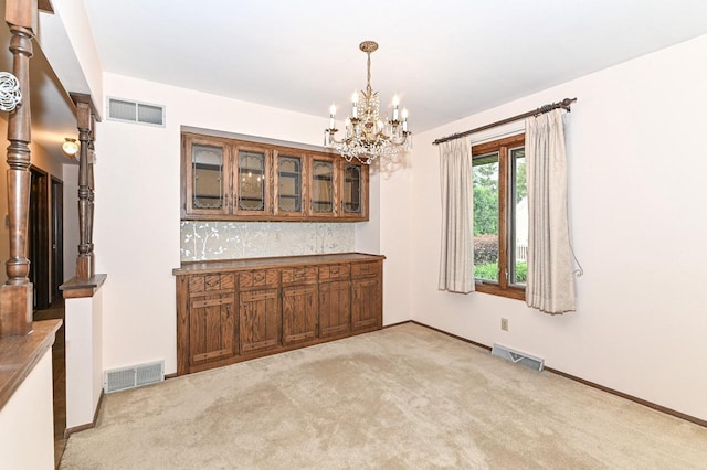 7701 W Coventry Dr, Franklin, WI 53132 - unfurnished dining area with a chandelier and light colored carpet