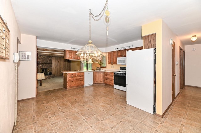 7701 W Coventry Dr, Franklin, WI 53132 - kitchen with white appliances, light countertops, a chandelier, a fireplace, and brown cabinetry