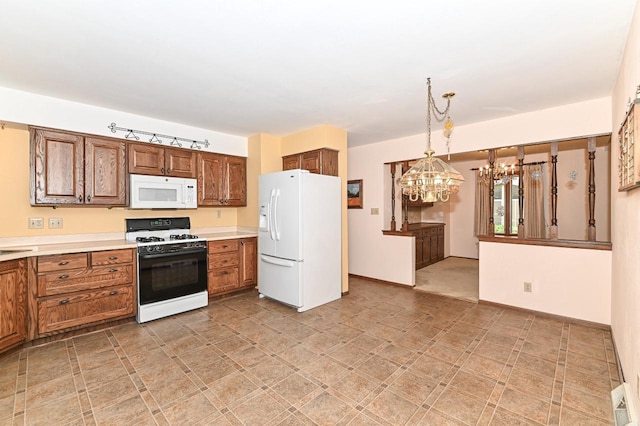 7701 W Coventry Dr, Franklin, WI 53132 - kitchen featuring white appliances, a chandelier, light countertops, pendant lighting, and brown cabinetry