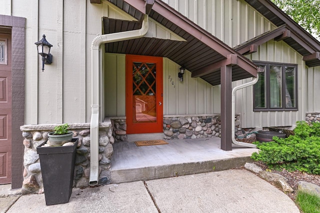 7701 W Coventry Dr, Franklin, WI 53132 - property entrance with board and batten siding and stone siding