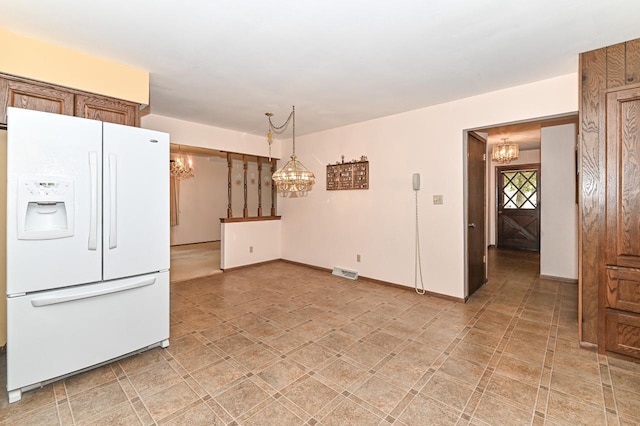 7701 W Coventry Dr, Franklin, WI 53132 - kitchen featuring white fridge with ice dispenser, a chandelier, and pendant lighting