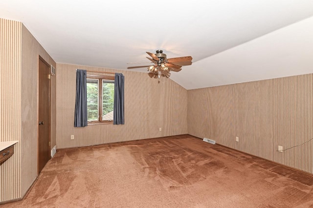 7701 W Coventry Dr, Franklin, WI 53132 - additional living space with light colored carpet, a ceiling fan, and vaulted ceiling