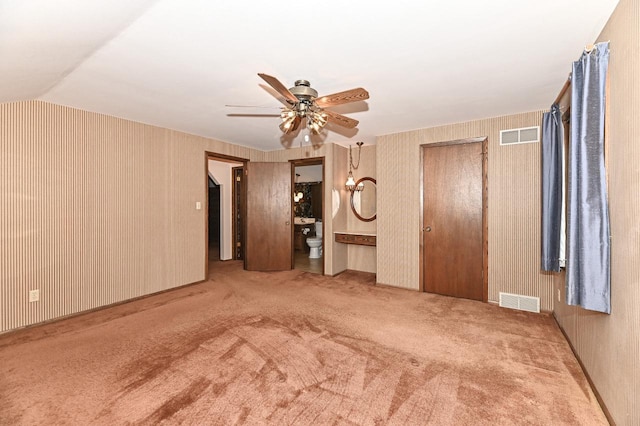 7701 W Coventry Dr, Franklin, WI 53132 - unfurnished bedroom featuring carpet floors, lofted ceiling, ensuite bathroom, ceiling fan, and wallpapered walls