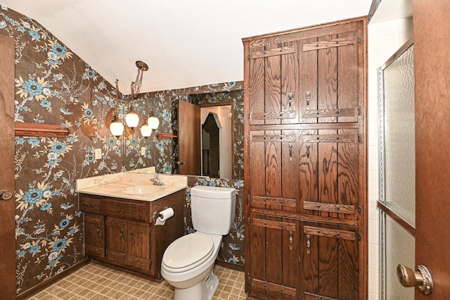 7701 W Coventry Dr, Franklin, WI 53132 - bathroom with vanity, wallpapered walls, and vaulted ceiling