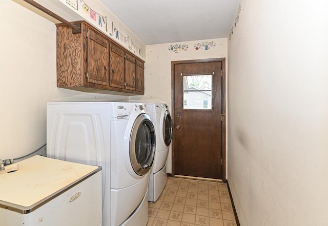 7701 W Coventry Dr, Franklin, WI 53132 - washroom featuring washer and clothes dryer, cabinet space, and light floors