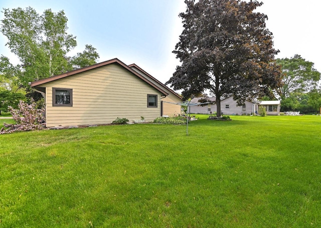 7701 W Coventry Dr, Franklin, WI 53132 - view of home's exterior featuring a lawn
