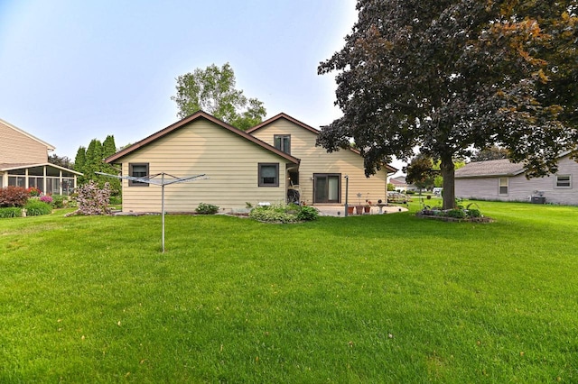 7701 W Coventry Dr, Franklin, WI 53132 - rear view of house featuring a yard and a patio area