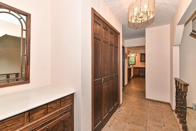 7701 W Coventry Dr, Franklin, WI 53132 - hall with a chandelier
