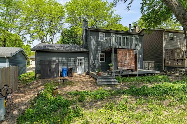 5717 Cedar Ridge Rd, Middleton, WI 53562 - back of house with a chimney, a wooden deck, and a balcony