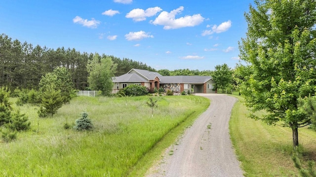 1022 Cortland Ln, Stevens Point, WI 54482 - ranch-style home with driveway and stone siding