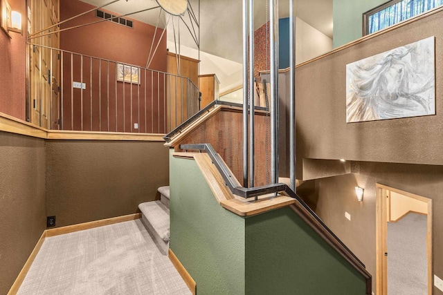 1022 Cortland Ln, Stevens Point, WI 54482 - stairway with a textured wall and carpet flooring