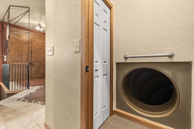 1022 Cortland Ln, Stevens Point, WI 54482 - washroom with a textured wall and tile patterned floors