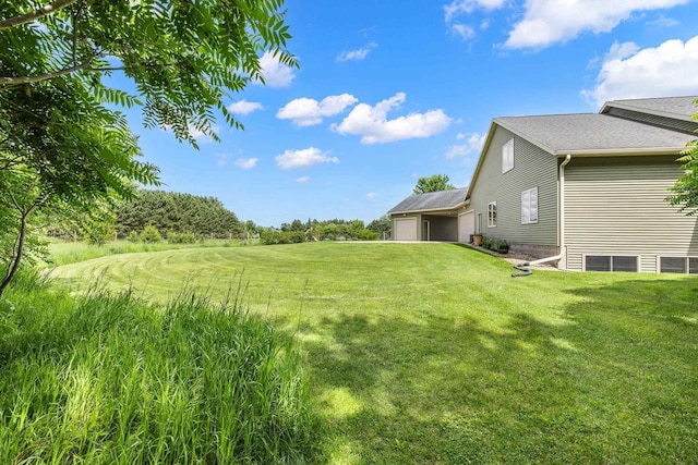 1022 Cortland Ln, Stevens Point, WI 54482 - view of grassy yard featuring a garage