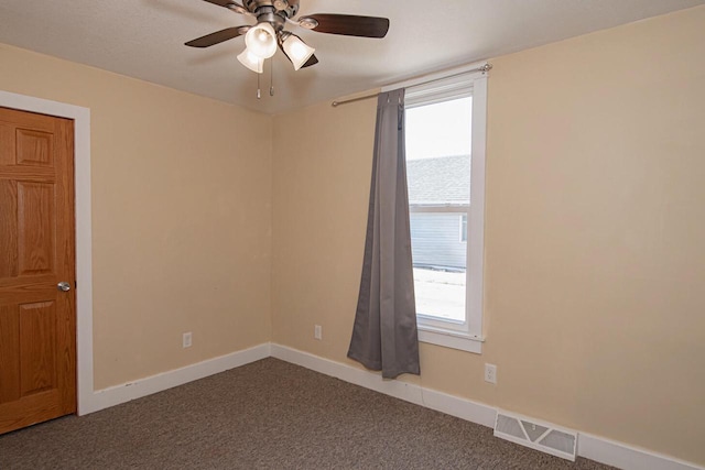 604 Wilson St, Winona, MN 55987 - empty room with dark carpet and ceiling fan