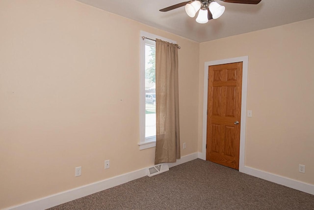 604 Wilson St, Winona, MN 55987 - unfurnished room with ceiling fan and dark colored carpet