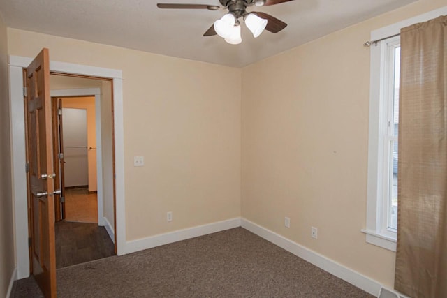 604 Wilson St, Winona, MN 55987 - empty room featuring ceiling fan and dark colored carpet