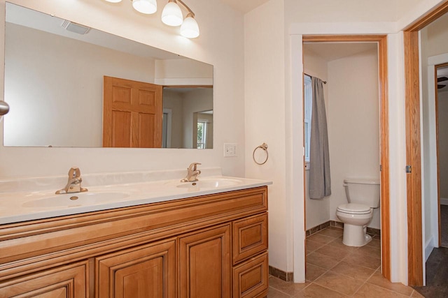 604 Wilson St, Winona, MN 55987 - full bathroom with double vanity and tile patterned flooring