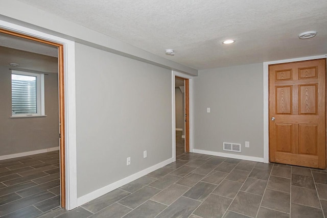 604 Wilson St, Winona, MN 55987 - empty room featuring a textured ceiling, recessed lighting, and a smoke detector
