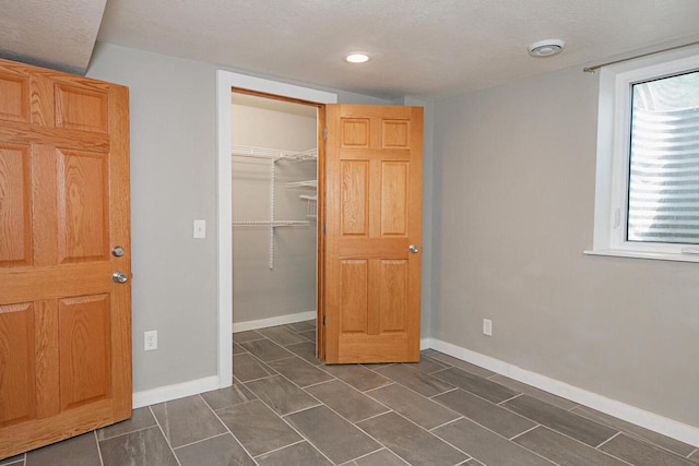 604 Wilson St, Winona, MN 55987 - unfurnished bedroom featuring a closet and recessed lighting