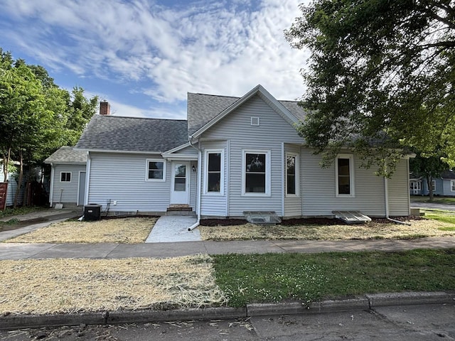 604 Wilson St, Winona, MN 55987 - view of front of property with a shingled roof, a chimney, and entry steps