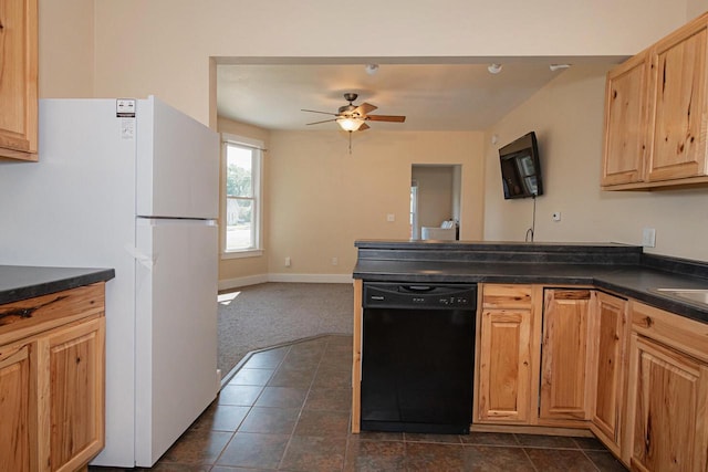 604 Wilson St, Winona, MN 55987 - kitchen with dishwasher, freestanding refrigerator, dark countertops, a peninsula, and a ceiling fan