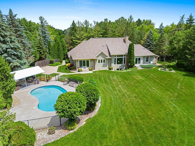 260 S Clay St, De Pere, WI 54115 - rear view of property featuring a fenced backyard, a chimney, a patio, entry steps, and a forest view