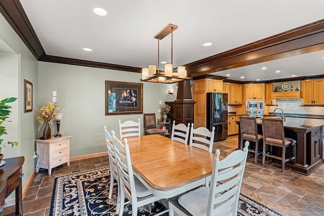 260 S Clay St, De Pere, WI 54115 - dining area featuring crown molding, stone tile flooring, a chandelier, and recessed lighting