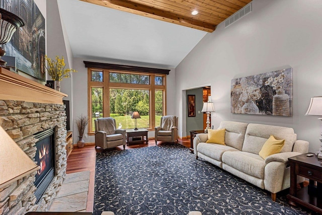 260 S Clay St, De Pere, WI 54115 - living room with high vaulted ceiling, wood finished floors, a stone fireplace, and a wooden ceiling with exposed beams
