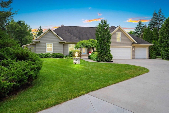 260 S Clay St, De Pere, WI 54115 - view of front of house featuring concrete driveway, a yard, and an attached garage
