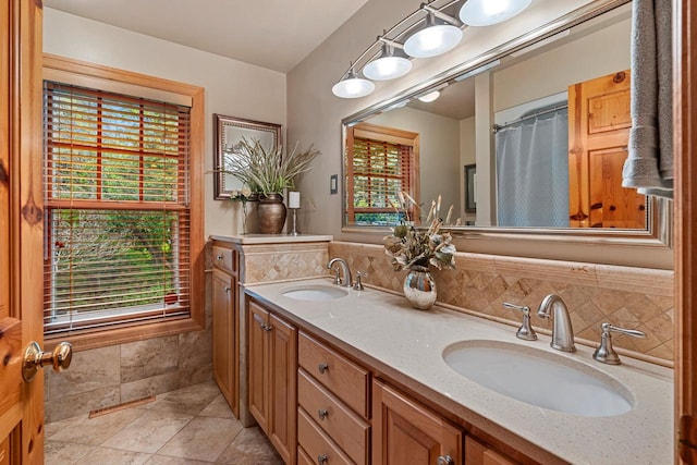 260 S Clay St, De Pere, WI 54115 - full bath featuring healthy amount of natural light, double vanity, and tasteful backsplash